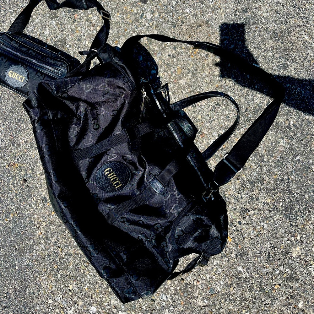 I have a black Gucci duffle bag. perfect carry on luggage bag
